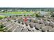 Beautiful aerial view of the neighborhood showcasing the community's layout and proximity to a golf course at 1536 Barnwell Pl, The Villages, FL 32162