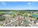 Stunning aerial shot highlighting the property's location near a golf course and scenic lakes at 1536 Barnwell Pl, The Villages, FL 32162
