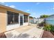 Cozy backyard featuring a decorative painted fence, a seating area, and lush landscaping perfect for outdoor living at 1536 Barnwell Pl, The Villages, FL 32162