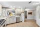 Spacious kitchen with updated stainless steel appliances, granite counters, and an open view to the rest of the home at 1536 Barnwell Pl, The Villages, FL 32162