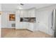 Well-designed kitchen with ample counter space, custom cabinetry, and tiled floors for easy maintenance and style at 1536 Barnwell Pl, The Villages, FL 32162