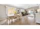 Bright and open living space featuring tile floors, vaulted ceilings, and a dining area perfect for gatherings at 1536 Barnwell Pl, The Villages, FL 32162