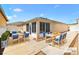 Inviting outdoor patio with multiple seating areas, ideal for enjoying the sunshine and fresh air at 1536 Barnwell Pl, The Villages, FL 32162