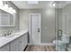Bathroom featuring a new vanity with light countertops, faucet and toilet with a walk-in shower at 1566 Lawndale Cir, Winter Park, FL 32792