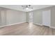 Spacious main bedroom with large closet and view of the ensuite bathroom at 1566 Lawndale Cir, Winter Park, FL 32792
