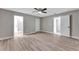 Spacious bedroom featuring modern flooring, neutral paint and multiple entry points at 1566 Lawndale Cir, Winter Park, FL 32792