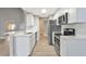 Bright kitchen with white cabinets and stainless steel appliances at 1566 Lawndale Cir, Winter Park, FL 32792
