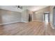 Vaulted ceilings and fan highlight this open living space with modern vinyl plank flooring at 1566 Lawndale Cir, Winter Park, FL 32792