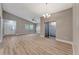 Bright, open living area featuring vaulted ceilings and modern wood-look flooring at 1566 Lawndale Cir, Winter Park, FL 32792