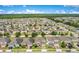 Panoramic aerial view of a residential neighborhood with neatly arranged homes and green landscape at 161 Williamson Dr, Davenport, FL 33897