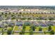 An aerial view of residential community with houses and green grass at 161 Williamson Dr, Davenport, FL 33897