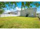 Spacious backyard with a well-maintained lawn and white fencing, offering privacy and room to roam at 161 Williamson Dr, Davenport, FL 33897