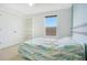 Bright bedroom with a built-in bookshelf and a window providing natural light at 161 Williamson Dr, Davenport, FL 33897