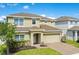 Attractive two-story home with well-manicured lawn and a two car garage at 161 Williamson Dr, Davenport, FL 33897