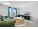 This room has a sofa, bean bag chair, and large window, offering a comfortable place to unwind at 161 Williamson Dr, Davenport, FL 33897