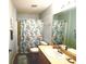 Functional bathroom with a shower-tub combo, a vanity, and a decorative shower curtain at 1650 Duran Dr, The Villages, FL 32162
