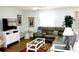Inviting living room boasting a large window, wood floors, and stylish decor at 1650 Duran Dr, The Villages, FL 32162