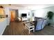 Bright living room featuring wood floors, ceiling fan and a comfortable seating area at 1650 Duran Dr, The Villages, FL 32162