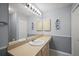 Bright bathroom with a large mirror and plenty of counter space at 1733 Oakville Pl, The Villages, FL 32162