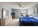Bright bedroom featuring a dresser, ceiling fan and neutral-colored walls at 1733 Oakville Pl, The Villages, FL 32162