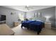 Comfortable bedroom with natural light, neutral tones, and ceiling fan at 1733 Oakville Pl, The Villages, FL 32162