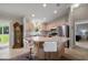 Well-lit open kitchen with stainless steel appliances and a breakfast bar at 1733 Oakville Pl, The Villages, FL 32162