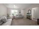 Bright living room featuring comfortable seating and neutral decor at 1733 Oakville Pl, The Villages, FL 32162