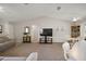 Bright living room with a high ceiling and views of the dining area at 1733 Oakville Pl, The Villages, FL 32162