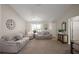 Comfortable living room featuring a ceiling fan and neutral-toned furniture at 1733 Oakville Pl, The Villages, FL 32162