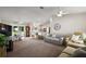 Spacious living area with a dining set and an open-concept kitchen at 1733 Oakville Pl, The Villages, FL 32162