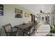 Enclosed patio with plenty of seating and a ceiling fan at 1733 Oakville Pl, The Villages, FL 32162