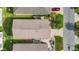 Aerial view of the home with a focus on the roof and well-manicured yard at 17428 Se 82Nd Albemarle Ave, The Villages, FL 32162