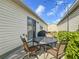 Outdoor patio with dining table and chairs, perfect for entertaining or relaxing al fresco at 17428 Se 82Nd Albemarle Ave, The Villages, FL 32162