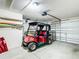 Spacious garage featuring an included golf cart at 17428 Se 82Nd Albemarle Ave, The Villages, FL 32162
