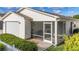 Enclosed screened patio with comfortable seating, offering a relaxing outdoor living space at 17428 Se 82Nd Albemarle Ave, The Villages, FL 32162
