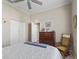 Bedroom features neutral color palette and ceiling fan at 17769 Se 121St Terrace Rd, Summerfield, FL 34491
