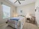 Bedroom features neutral color palette and ceiling fan at 17769 Se 121St Terrace Rd, Summerfield, FL 34491