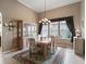 Bright dining room featuring a chandelier and lots of natural light at 17769 Se 121St Terrace Rd, Summerfield, FL 34491