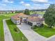 Stunning single-story home boasts lush landscaping and a golf course view at 17769 Se 121St Terrace Rd, Summerfield, FL 34491