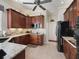 Well-lit kitchen showcases granite countertops and wood cabinets, complemented by modern appliances at 17769 Se 121St Terrace Rd, Summerfield, FL 34491