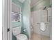 Cozy bathroom with walk-in shower, toilet and window at 1804 Estafana Way, The Villages, FL 32159