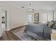 Relaxing bedroom with a ceiling fan and ensuite bathroom at 1804 Estafana Way, The Villages, FL 32159