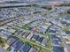 Aerial view of a well-planned residential community with amenities, showcasing a vibrant and convenient living environment at 1914 Hux Ct, The Villages, FL 34762