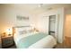 A cozy bedroom with a ceiling fan, closet, and stylish decor, providing a comfortable and inviting personal space at 1914 Hux Ct, The Villages, FL 34762