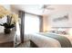 Bright bedroom featuring a large window, stylish decor, and modern amenities, offering a comfortable and inviting retreat at 1914 Hux Ct, The Villages, FL 34762