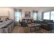 Inviting living room with modern furnishings, stylish decor, and lots of natural light at 1914 Hux Ct, The Villages, FL 34762