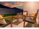 Outdoor patio featuring comfortable seating and stylish decor, creating a relaxing and inviting space for outdoor enjoyment at 1914 Hux Ct, The Villages, FL 34762