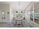 Elegant dining room with a modern chandelier and ample space for entertaining at 1940 Dempsey Ln, The Villages, FL 32163