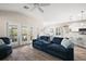 Spacious living room with ample seating, open layout, and easy access to the kitchen at 1940 Dempsey Ln, The Villages, FL 32163