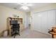 Well-lit home office featuring a desk, chair, closet and neutral walls at 1940 Dempsey Ln, The Villages, FL 32163
